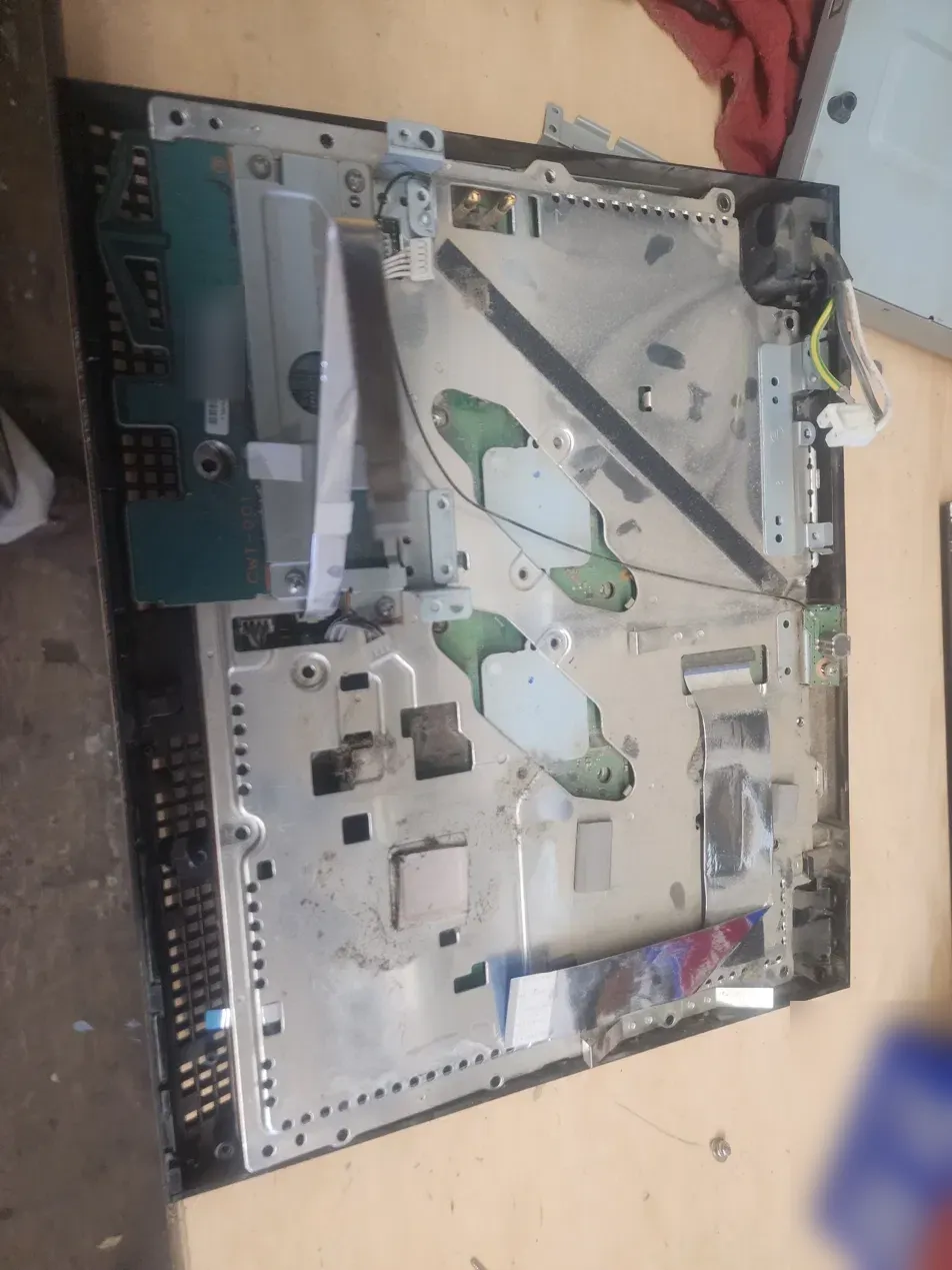 Dust and grime collected on the PS3 main shield near the heatsink cutouts