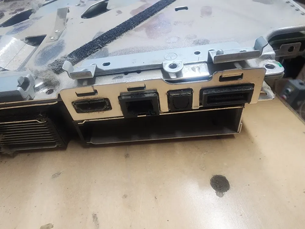 PS3 rear ports with dust and debris packed into the HDMI, Ethernet and optical audio openings