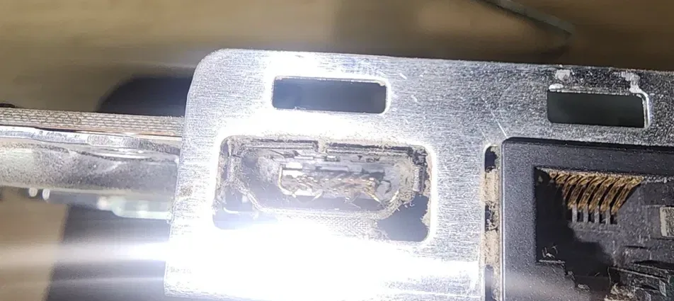 PS3 HDMI port close-up showing damaged and bent pins inside the connector